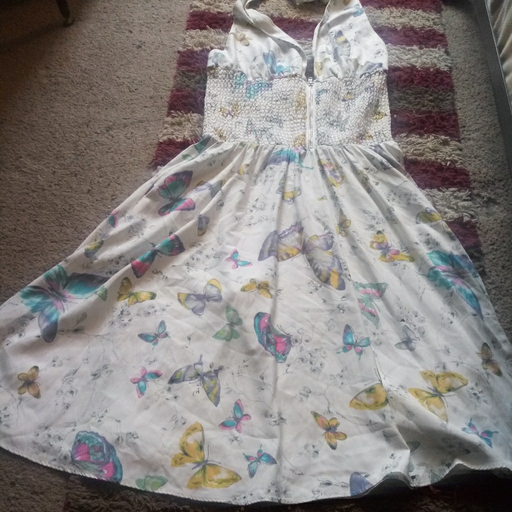 A cute white dress with butterflies on it